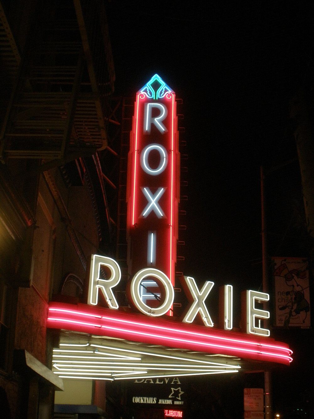The Roxie's red neon ROXIE sign glowing at night in San Francisco's Mission District